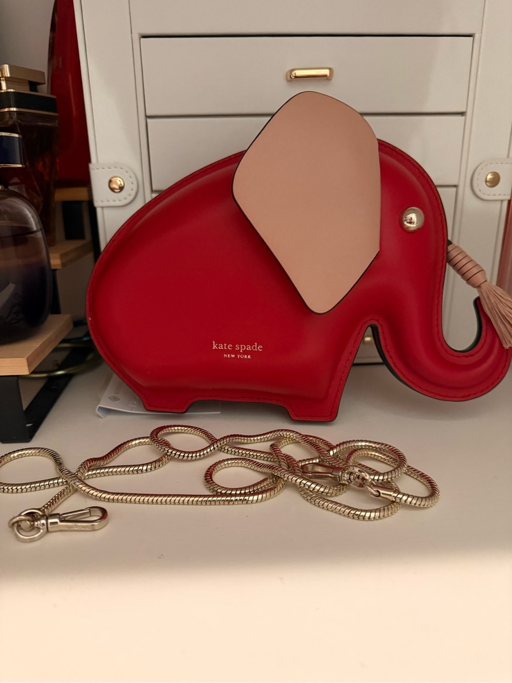 kate spade red elephant crossbody with blush ear and gold chain